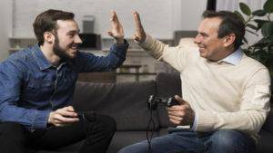 Image by <a href="https://www.freepik.com/free-photo/father-son-high-fiving_6881385.htm#query=gamer%20handshake&position=4&from_view=search&track=ais">Freepik</a>